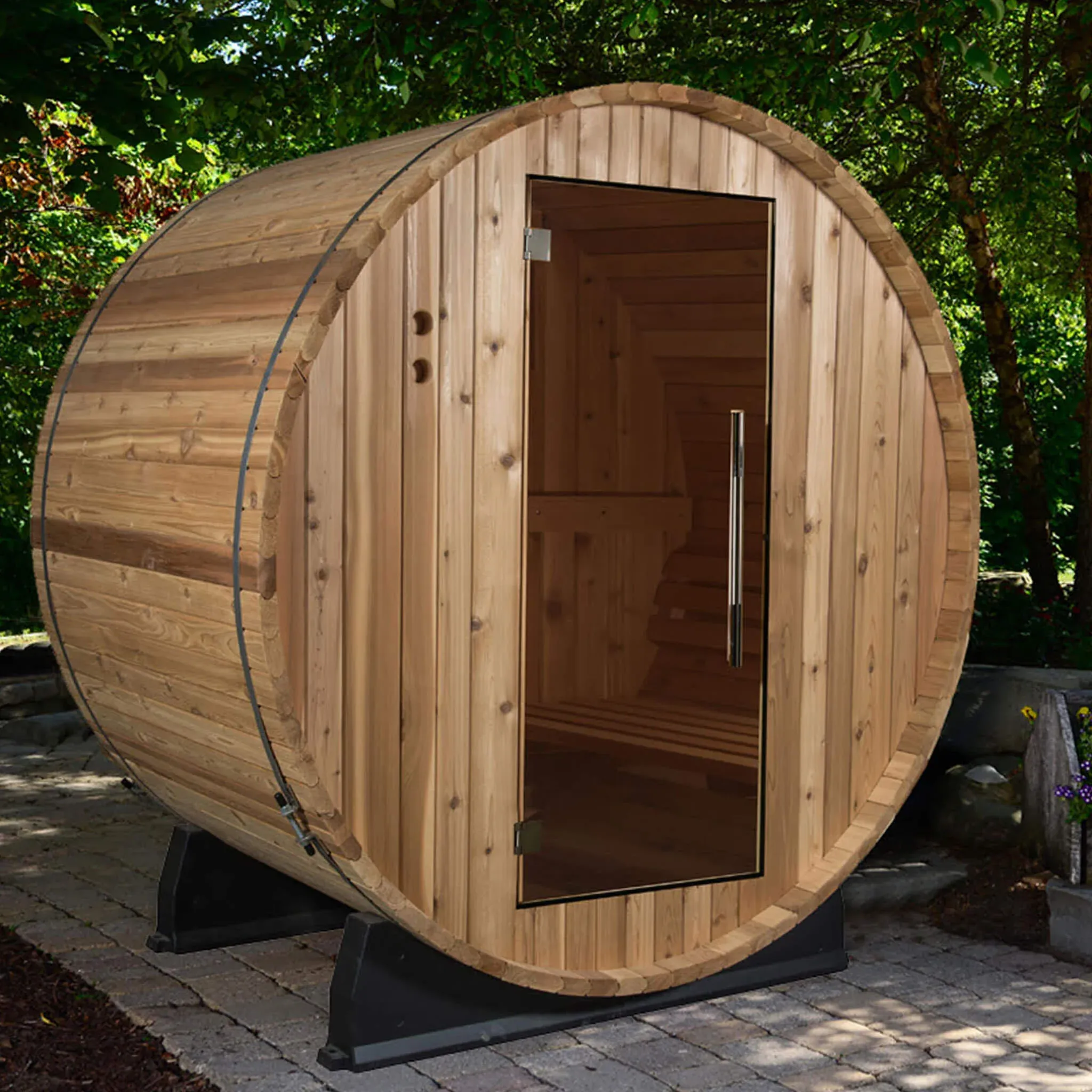 A timber barrel sauna in a garden